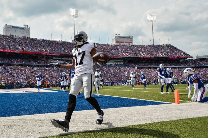Las Vegas Raiders wide receiver Davante Adams celebrates after scoring the team's only touchdown during their 38-10 loss to the Buffalo Bills at Highmark Stadium on September 17.