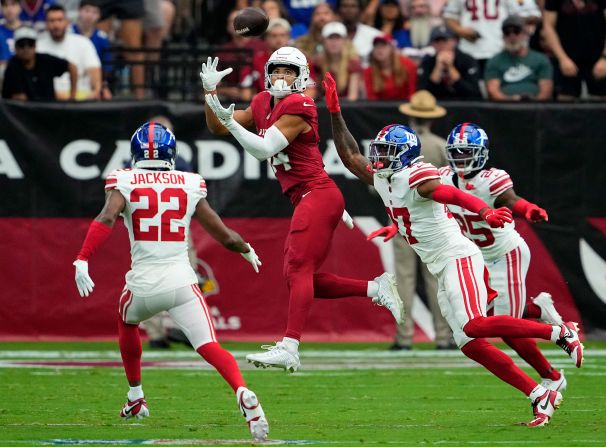 Arizona Cardinals wide receiver Michael Wilson makes a catch over New York Giants safety Jason Pinnock at State Farm Stadium on September 17. The Cardinals narrowly lost 31-28.