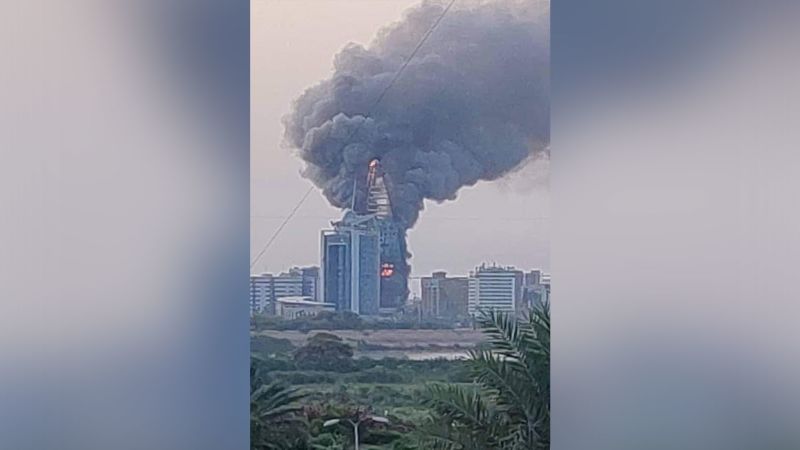NextImg:Landmark buildings ablaze in Khartoum as Sudan fighting erupts | CNN