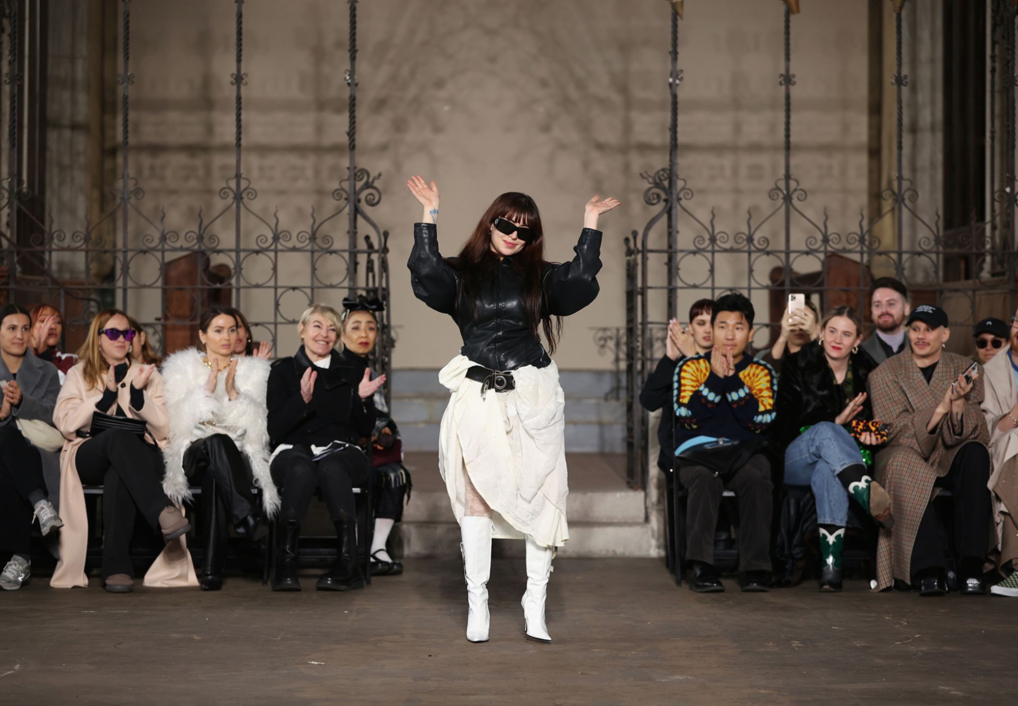 Designer, Dilara Findikoglu waves on the runway at the Dilara Findikoglu show during London Fashion Week February 2023 on February 20, 2023 in London, England.