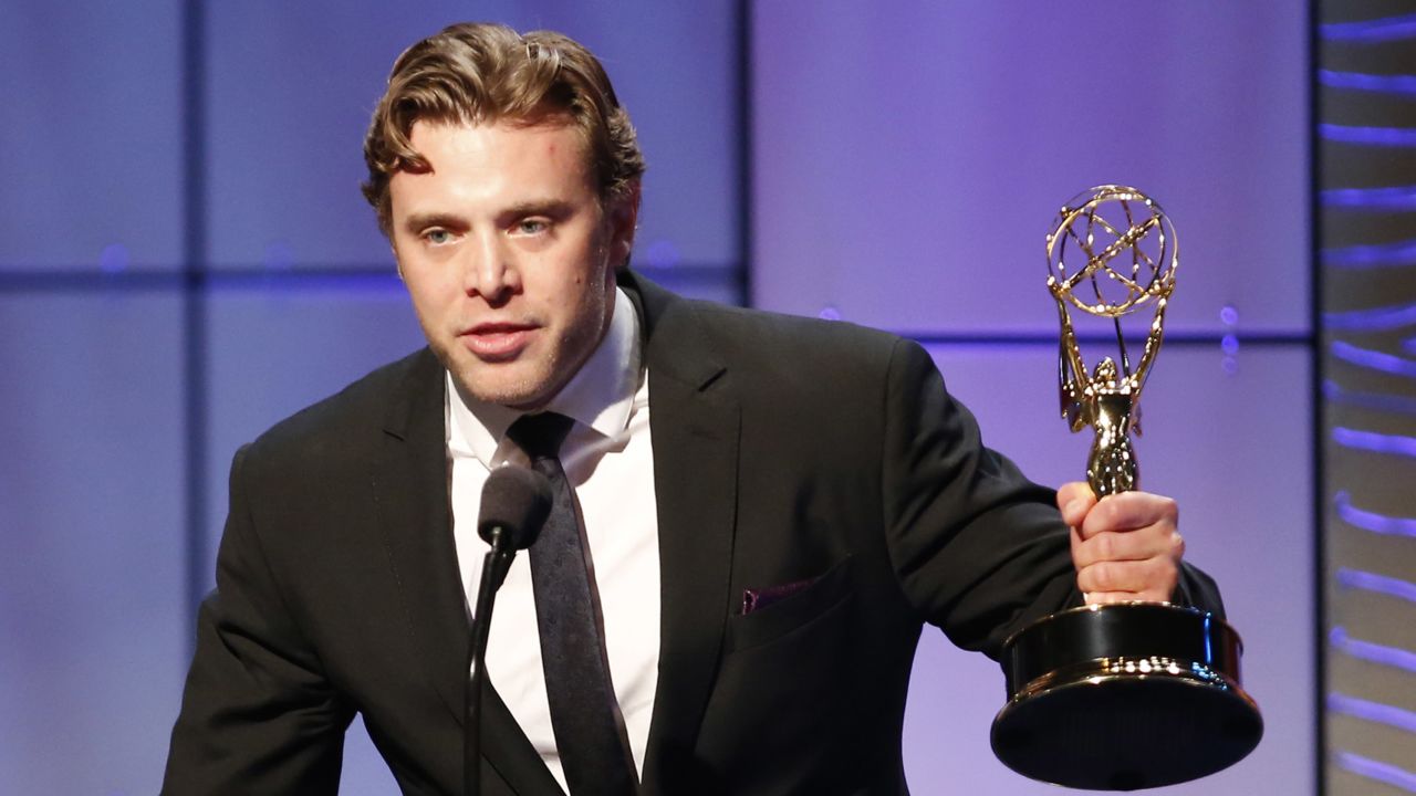 Miller receiving a Daytime Emmy award for outstanding supporting actor in a drama series in 2013