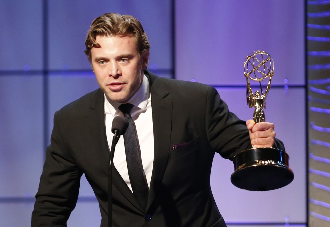 Miller receiving a Daytime Emmy award for outstanding supporting actor in a drama series in 2013