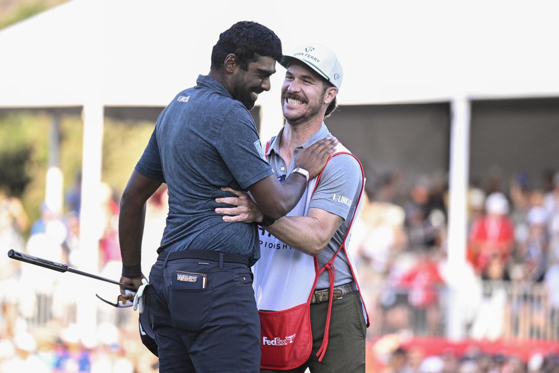 NAPA, CALIFORNIA - SEPTEMBER 17: Sahith Theegala of the United States celebrates his win on the 18th green with caddie Carl Smith during the final round of the Fortinet Championship at Silverado Resort and Spa on September 17, 2023 in Napa, California. (Photo by Orlando Ramirez/Getty Images)