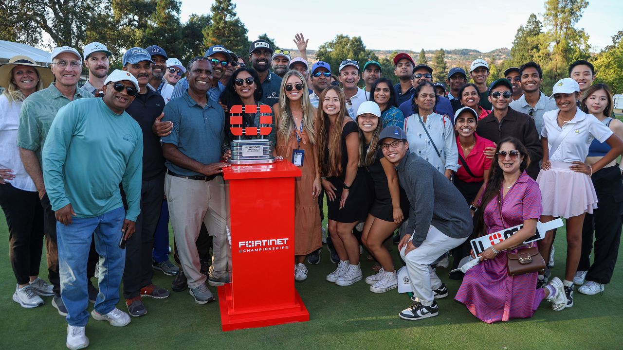 NAPA, CALIFORNIA - SEPTEMBER 17: Sahith Theegala of the United States celebrates with friends and family alongside the trophy after winning during the final round of the Fortinet Championship at Silverado Resort and Spa on September 17, 2023 in Napa, California. (Photo by Jed Jacobsohn/Getty Images)