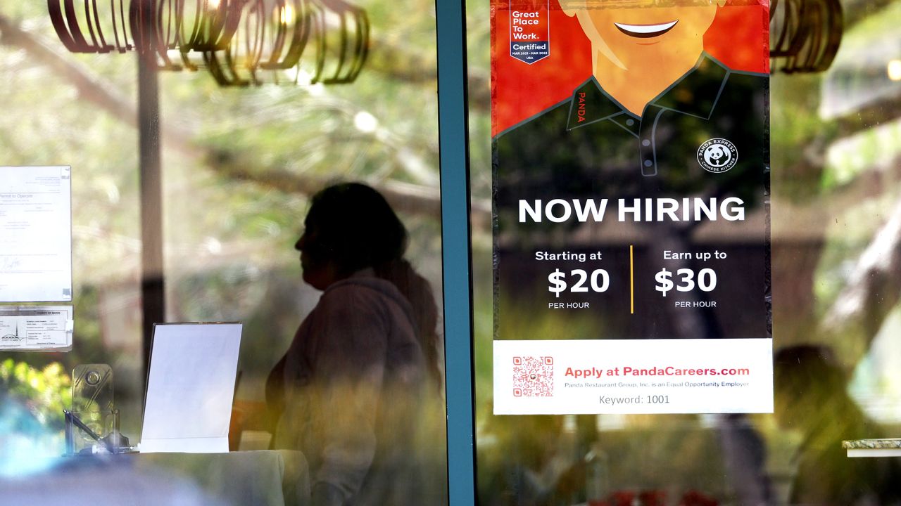 A now hiring sign is posted at a Panda Express restaurant on August 05, 2022 in Marin City, California. 
