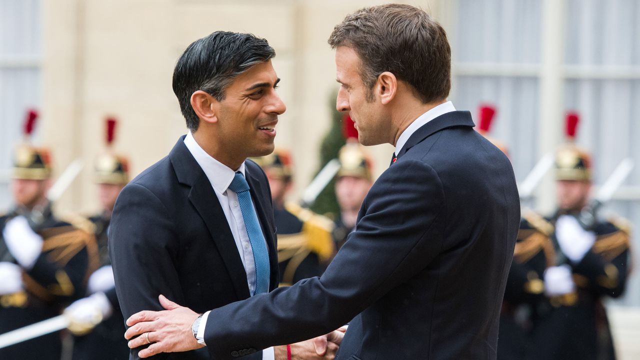 France's Emmanuel Macron greets UK Prime Minister Rishi Sunak ahead of their bilateral meeting at the Elysee Palace in Paris on March 10, 2023.