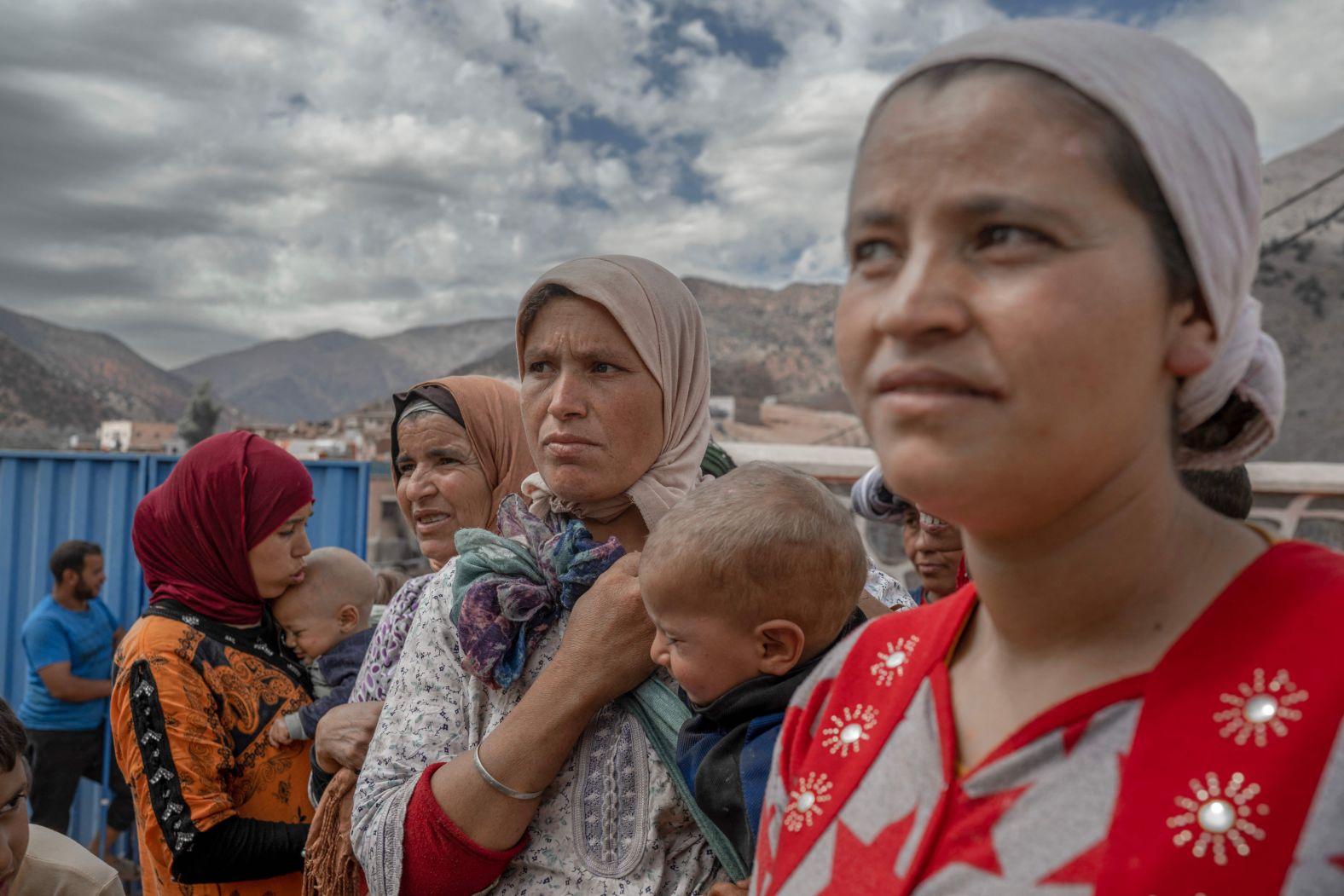 People wait to receive assistance in their village between the cities of Marrakech and Taroudant on Sunday, September 17.