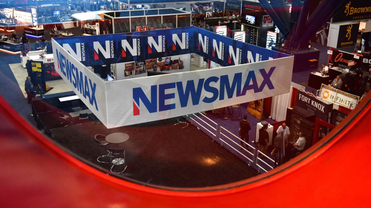 A Newsmax booth broadcasts as attendees try out the guns on display at the National Rifle Association (NRA) annual convention in Houston, Texas, U.S. May 29, 2022.