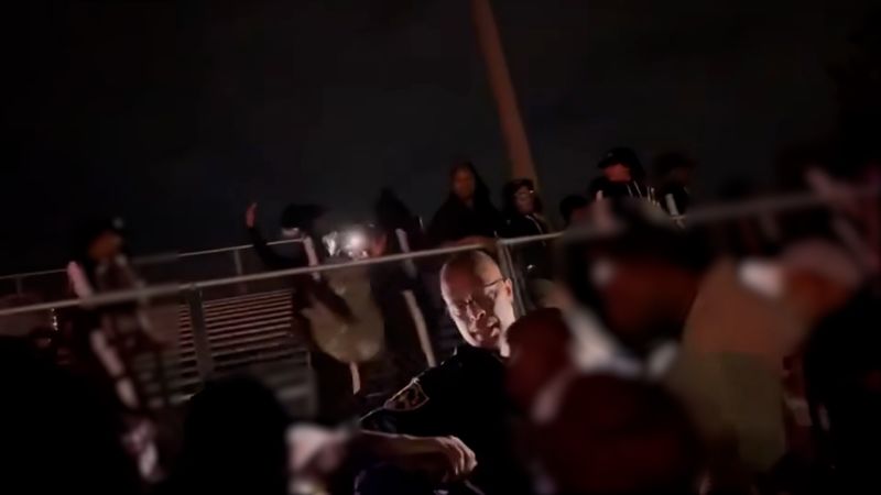 NextImg:Alabama band director tased and arrested after high school football game for refusing to stop performance, police say | CNN