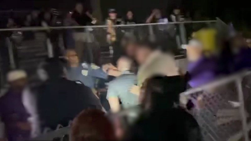 shows band director being tased for not stopping band’s performance