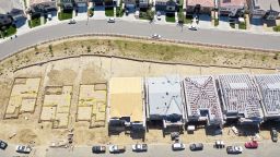 An aerial view of existing homes near new homes under construction (BOTTOM) in the Chatsworth neighborhood on September 08, 2023 in Los Angeles, California. According to the National Association of Realtors, the median existing home sale price in the U.S. increased 1.9 percent in July following five straight months of declines, which was the longest stretch of declines in 11 years, amid high-interest rates. 