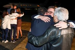 Family members embrace freed Americans Siamak Namazi, Morad Tahbaz and Emad Shargi — as well as two returnees whose names have not yet been released by the U.S. government — who were released in a prisoner swap deal between U.S and Iran, as they arrive at Davison Army Airfield at Fort Belvoir, Virginia, U.S., September 19, 2023. 