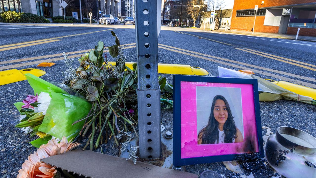 A photo of Jaahnavi Kandula is displayed with flowers on January 29 at the intersection where she was killed.