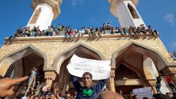 People who survived the deadly storm that hit Libya, protest outside the Al Sahaba mosque against the government in Derna, Libya September 18, 2023. The sign reads: "The sad city of Derna demands its rights". REUTERS/Zohra Bensemra