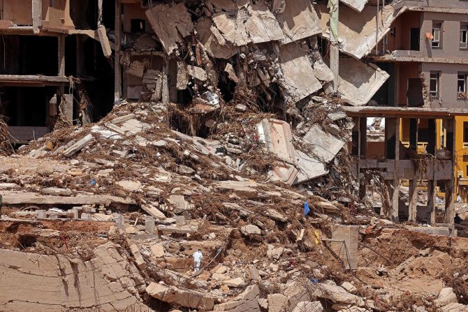 A building is damaged in Derna on September 18. Experts say the <a href="index.php?page=&url=https%3A%2F%2Fwww.cnn.com%2F2023%2F09%2F16%2Fworld%2Flibya-flood-death-toll-rise-derna-intl-hnk%2Findex.html" target="_blank">storm's impact</a> was greatly exacerbated by a lethal confluence of factors, including aging, crumbling infrastructure; inadequate warnings; and the effects of the accelerating climate crisis.