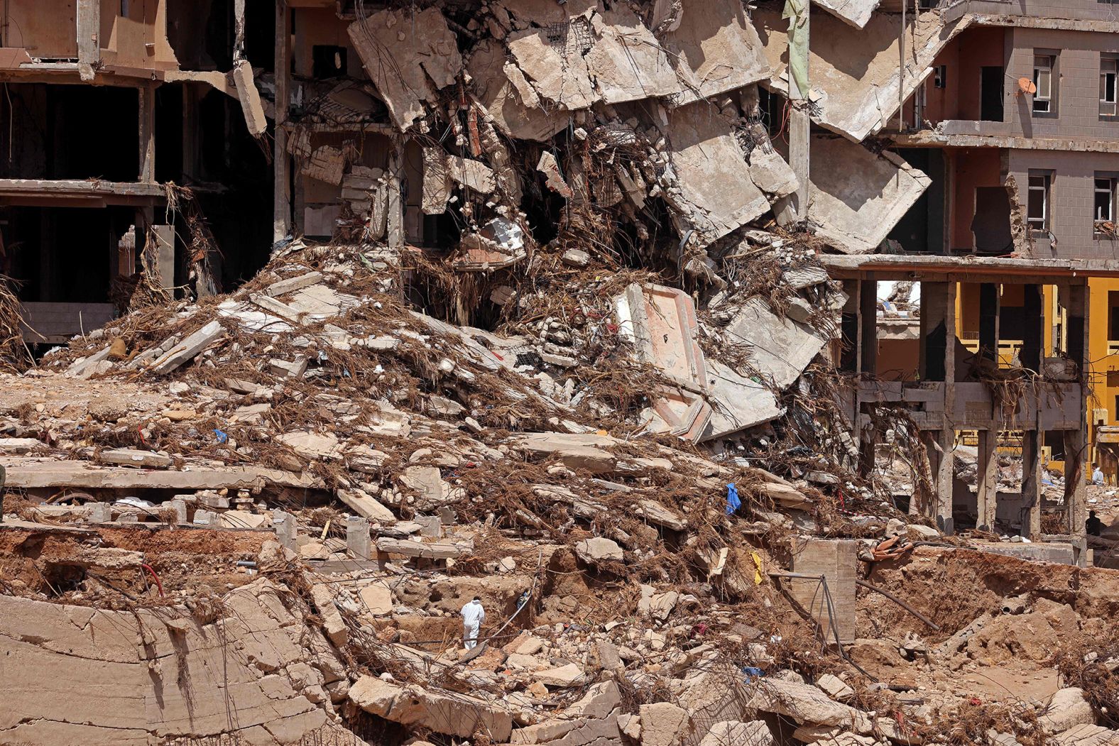 A building is damaged in Derna on September 18. Experts say the <a target="_blank">storm's impact</a> was greatly exacerbated by a lethal confluence of factors, including aging, crumbling infrastructure; inadequate warnings; and the effects of the accelerating climate crisis.
