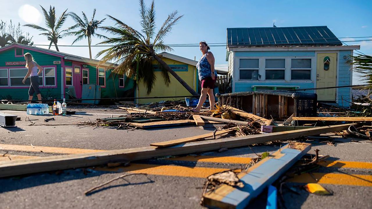 A homeowner surveys damage in Matlacha, Florida, on September 29, 2022, after Hurricane Ian.