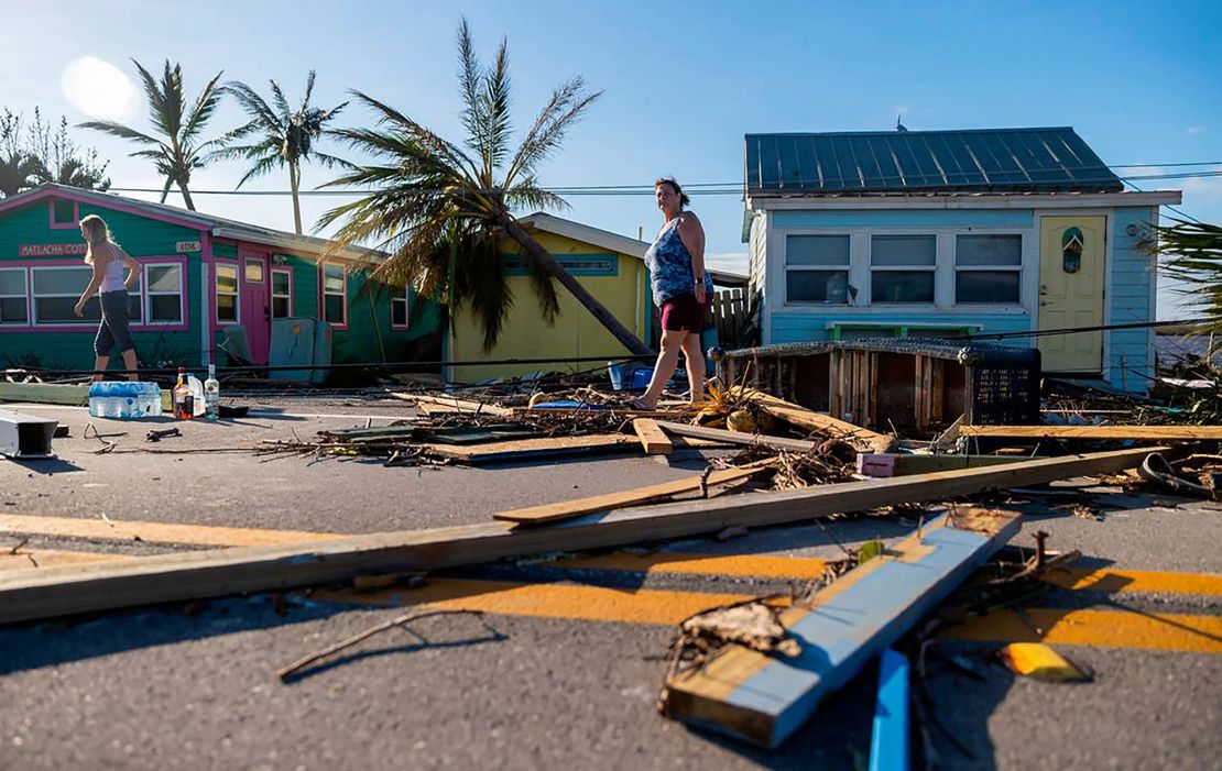A homeowner surveys damage in Matlacha, Florida, on September 29, 2022, after Hurricane Ian.