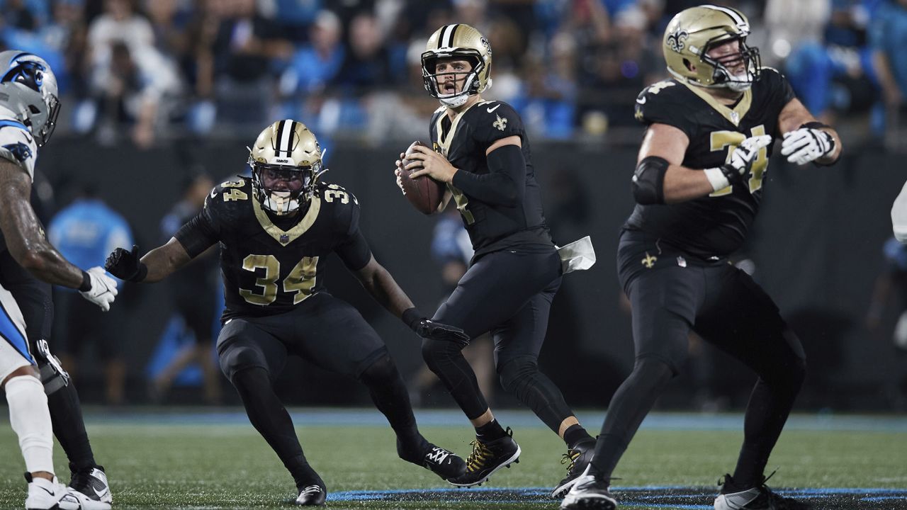 New Orleans Saints quarterback Derek Carr (4) drops back to pass during an NFL football game against the Carolina Panthers, Monday, Sep. 18, 2023, in Charlotte, N.C. (AP Photo/Brian Westerholt)