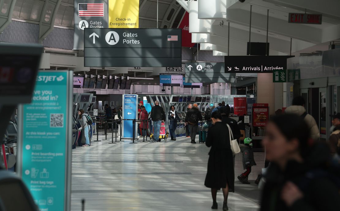 TORONTO, ON- MARCH 9  - Terminal 3 travellers walk to check-in and wait for flights. Pearson International Airport is calm on the eve of one of the busiest stretches of holiday travel leading into the March Break in Toronto. March 9, 2023.        (Steve Russell/Toronto Star via Getty Images)