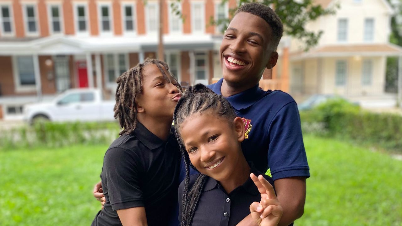 Izaiah Carter, right, and his siblings, Amari, left, and Micayla. This image was taken using an iPhone's portrait mode.