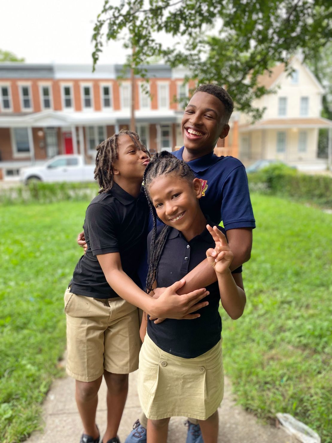 Izaiah Carter, right, and his siblings, Amari, left, and Micayla. This image was taken using an iPhone's portrait mode. 