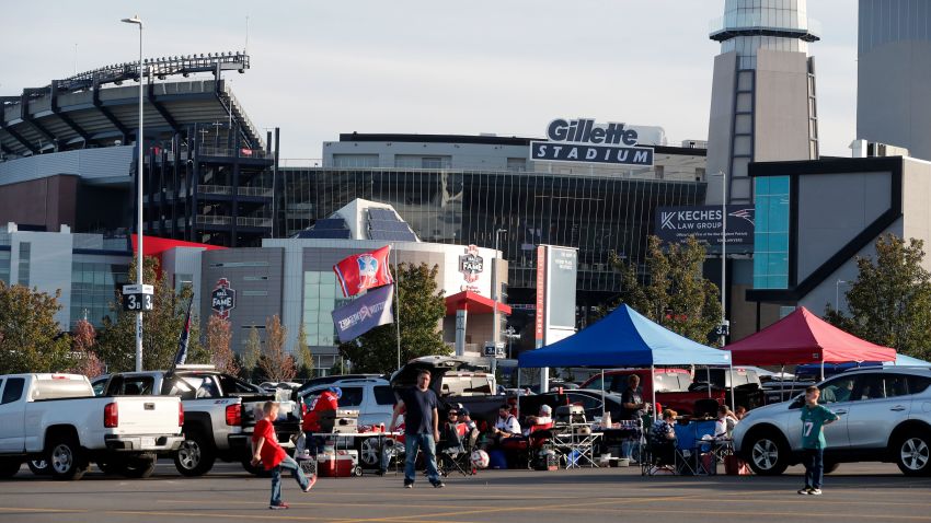 People tailgate outside Gillette Stadium before an NFL football game between the New England Patriots and the Miami Dolphins, Sunday, Sept. 16, 2023, in Foxborough, Mass. (AP Photo/Michael Dwyer)