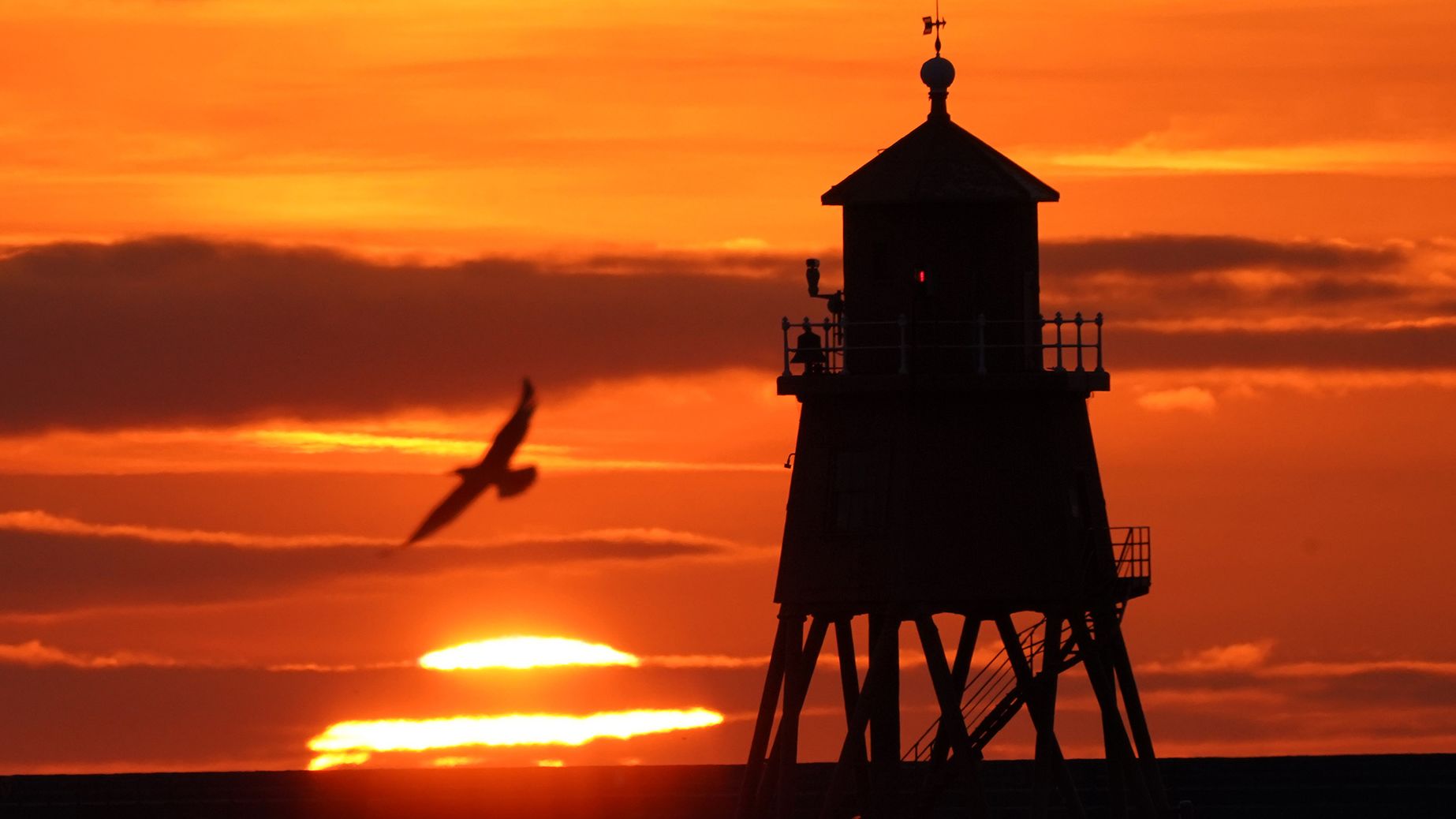 Sunrise at the Herd Groyne lighthouse in South Shields on the North East coast on the Autumn Equinox. Picture date: Wednesday September 22, 2021, 2021. (Photo by Owen Humphreys/PA Images via Getty Images)