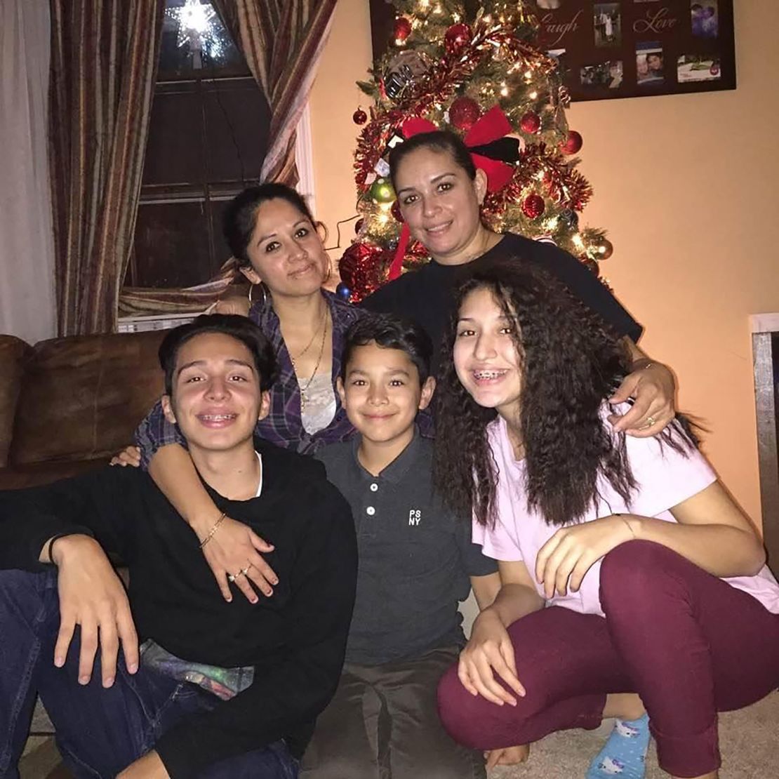 Eubdulia and Claudia (right) celebrate the holidays with their children Alejandro, Alex and Vanessa when they were younger.