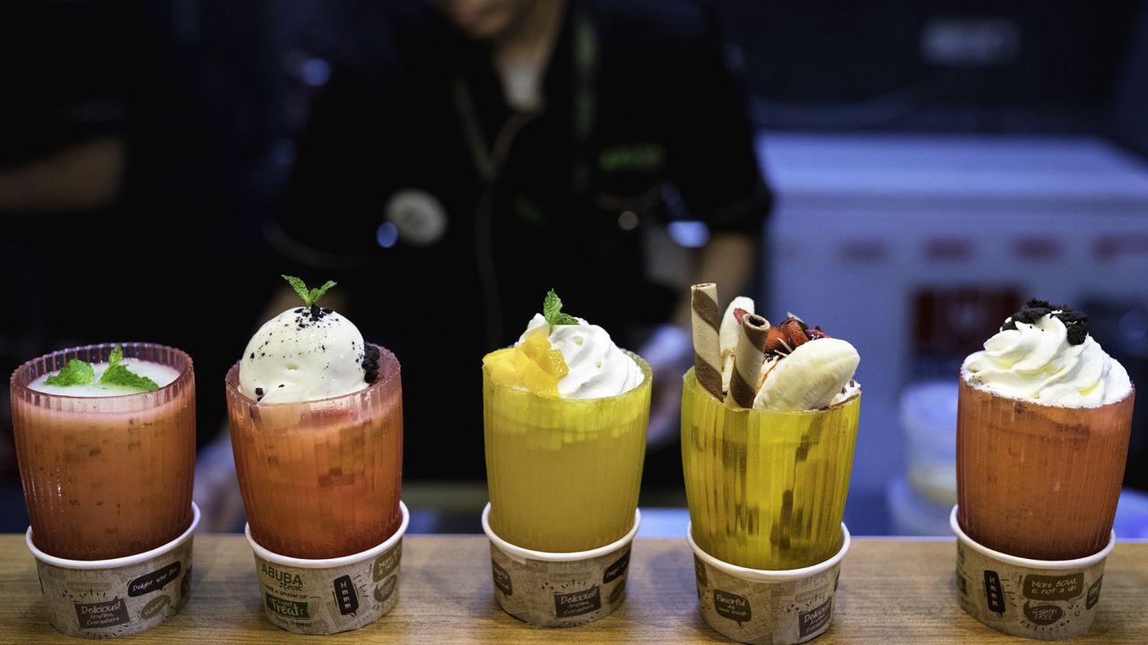 JAKARTA, JAVA, INDONESIA - 2016/08/31: A restaurant server in Jakarta carries ice cream in an edible cup made of seaweed. In the race for a sustainable alternative to plastic, Indonesia bets on seaweed Edible cups made from seaweed. Shopping bags from cassava starch. Food containers from sugarcane fiber. These are some of the bioplastic alternatives being tried out in Indonesia, the world'-s No. 2 producer of seaweed. (Photo by Jonas Gratzer/LightRocket via Getty Images)