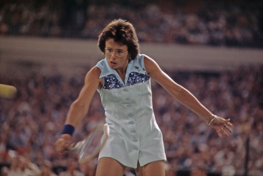 King hits a shot during the match against Riggs. At this point in her career, she had won 10 grand slam singles titles.