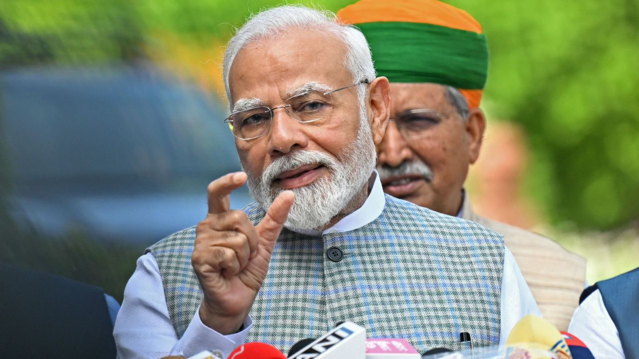 India's Prime Minister Narendra Modi addresses the media representatives upon his arrival to attend the special session of the parliament in New Delhi on September 18, 2023. (Photo by Money SHARMA / AFP) (Photo by MONEY SHARMA/AFP via Getty Images)