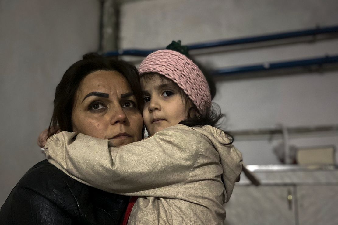 A girl embraces her relative sitting in a shelter during shelling in Stepanakert, Nagorno-Karabakh. 