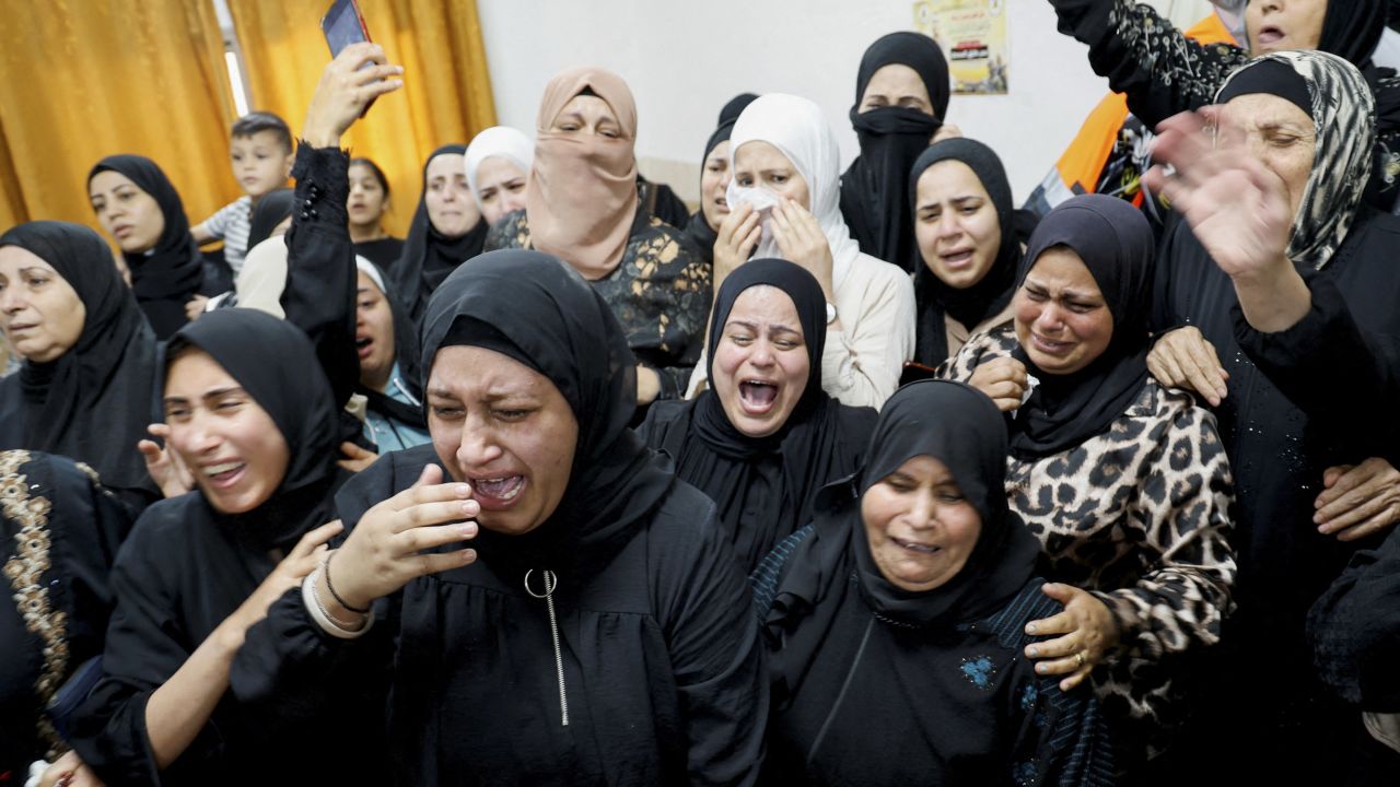 Mourners attend the funeral of a Palestinian who was killed in an Israeli military raid in the Jenin refugee camp.