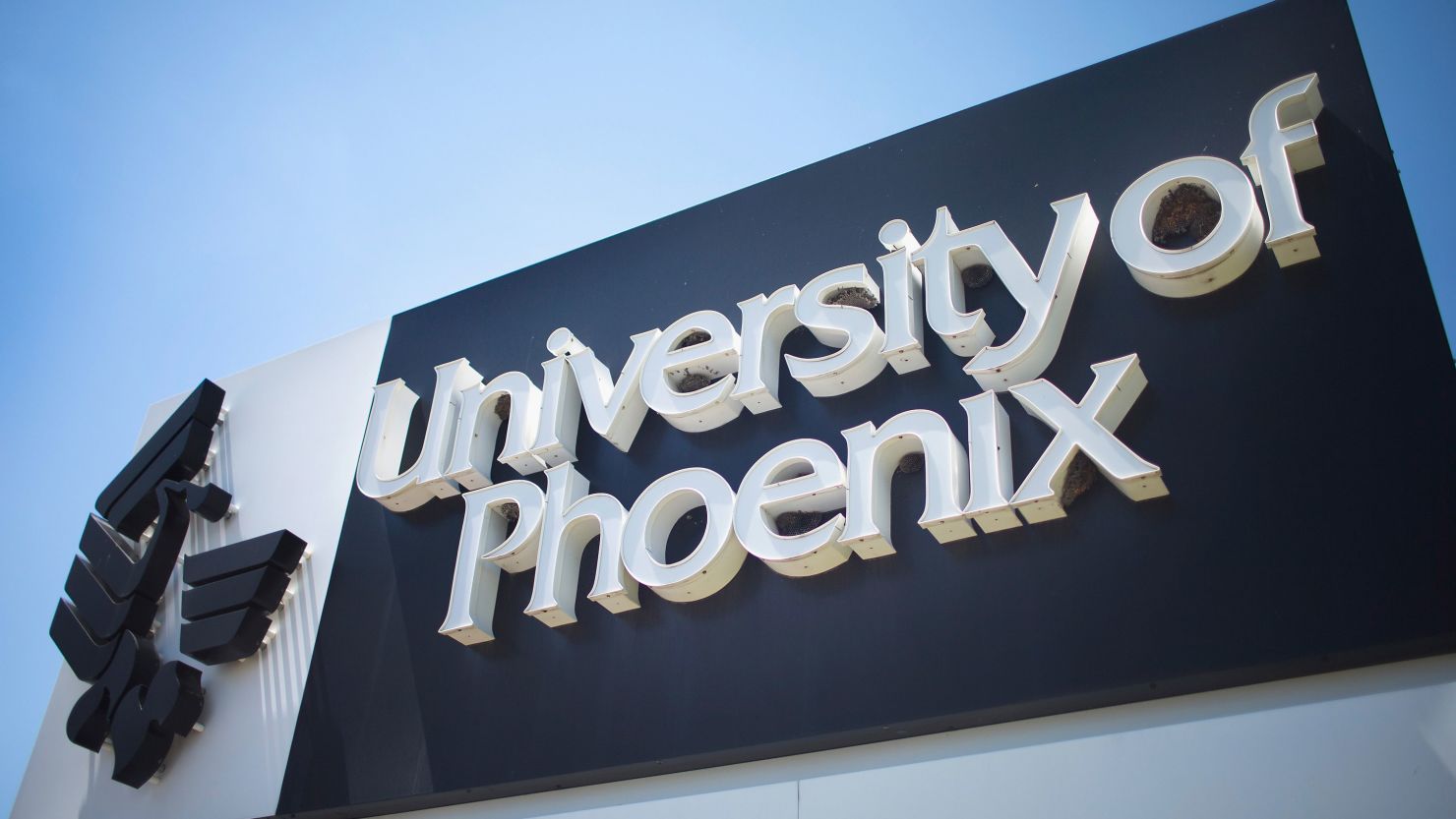 A sign marks the location of the University of Phoenix Chicago campus on July 30, 2015, in Schaumburg, Illinois.