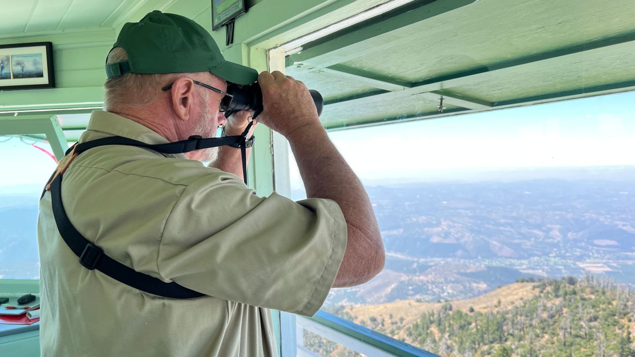 Bill Angel, a volunteer with the Forest Fire Lookout Association, monitors emerging wildfires.