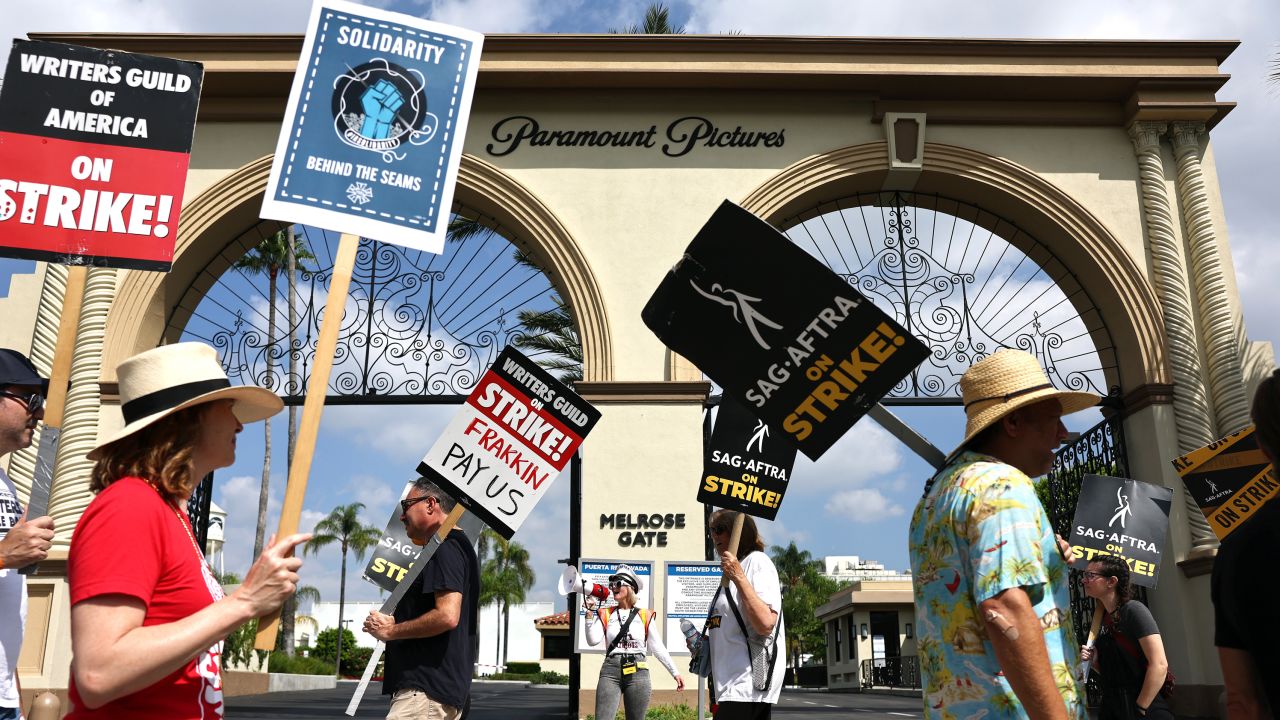 WGA members picket with striking SAG-AFTRA members outside Paramount Studios in September. 