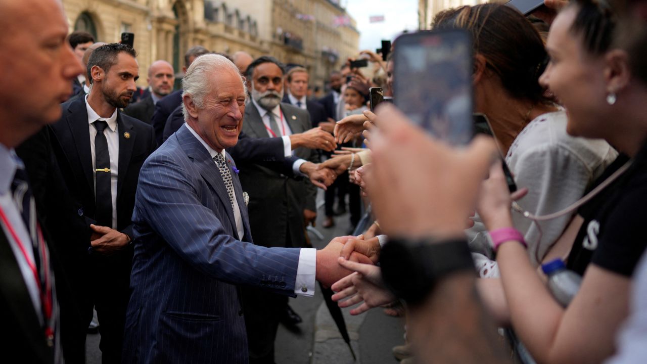 The King delighted members of the French public during a walk from the Elysee Palace to the British ambassador to France's residence on Wednesday afternoon. 