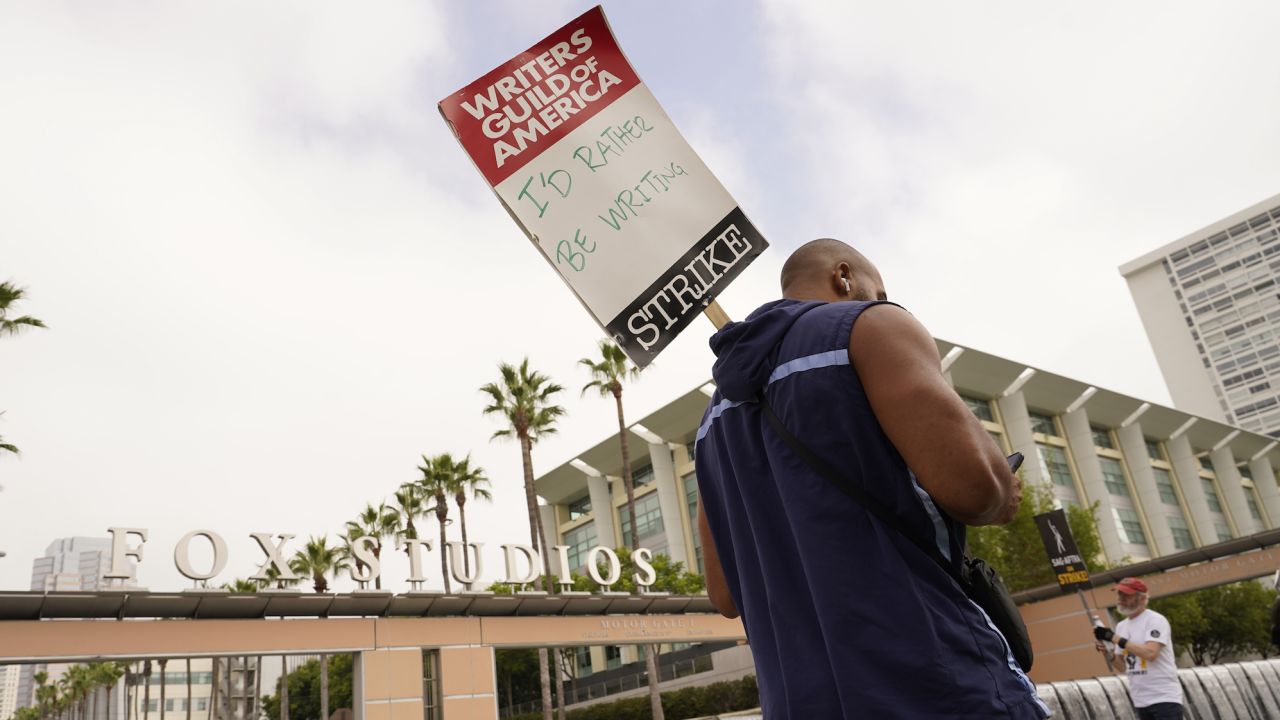 Picketers carry signs outside Fox studios on Monday, Aug. 14, 2023, in Los Angeles.