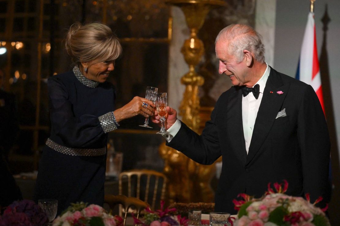 Britain's King Charles with the French first lady Brigitte Macron at the Palace of Versailles, west of Paris, on Wednesday.