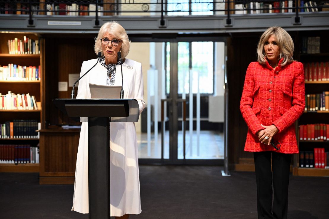 Queen Camilla delivers a speech next to French President's wife Brigitte Macron at the national library in Paris. 