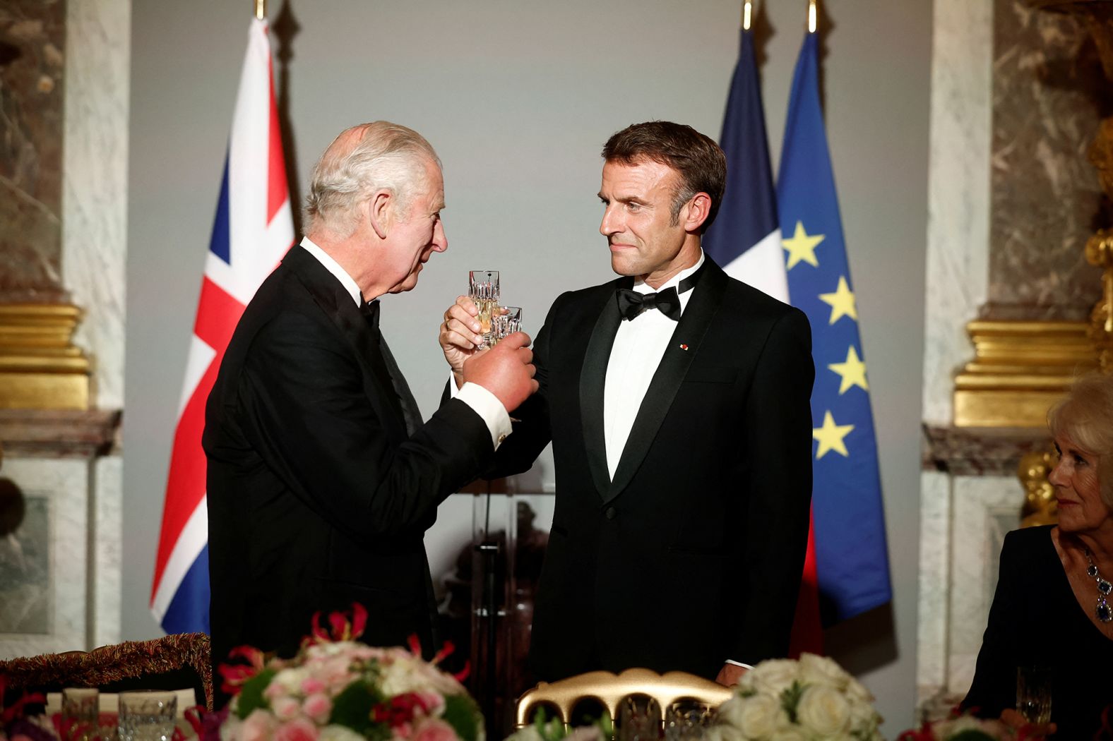 The King shares a toast with French President Emmanuel Macron during a state dinner at the Palace of Versailles in Versailles, France, in September 2023. It was the first day of <a href="https://edition.cnn.com/2023/09/20/europe/king-charles-france-state-visit-intl/index.html" target="_blank">Charles' state visit to France</a>.