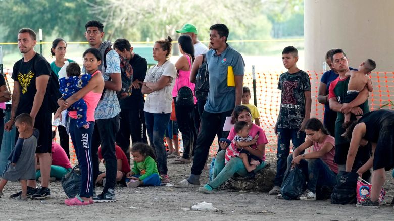 Migrants who crossed into the U.S. from Mexico wait to be processed by U.S. Border Patrol agents, Thursday, Sept. 21, 2023, in Eagle Pass, Texas. (AP Photo/Eric Gay)