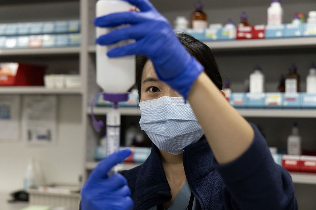 Inpatient pharmacist Selena Ko reconstitutes powered antibiotic amoxicillin and measures doses for pediatric patients on Nov. 10, 2022, at Rush University Medical Center in Chicago. (Erin Hooley/Chicago Tribune/Tribune News Service via Getty Images)