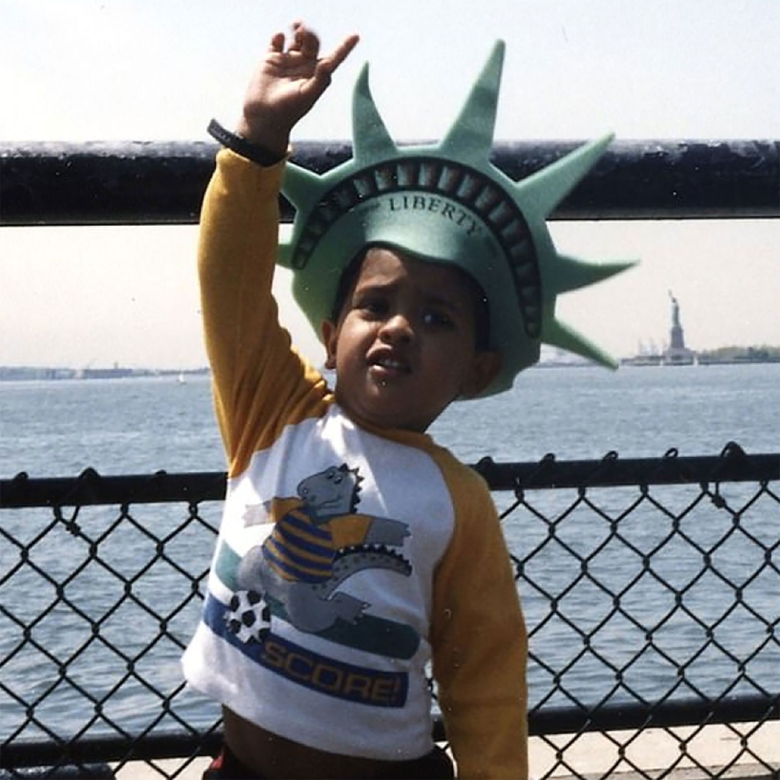 In this undated photo from Ramaswamy's campaign website, a young Ramaswamy poses like the Statue of Liberty in New York. 