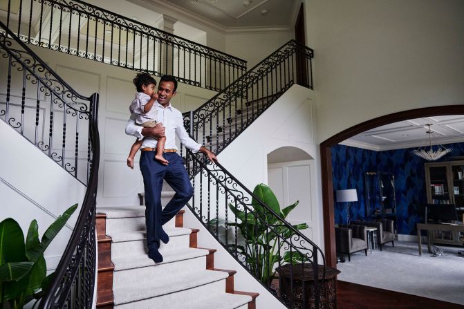 Ramaswamy carries his son Karthik at their home in Columbus, Ohio, in 2021. Ramaswamy and his wife, Apoorva, have two sons.