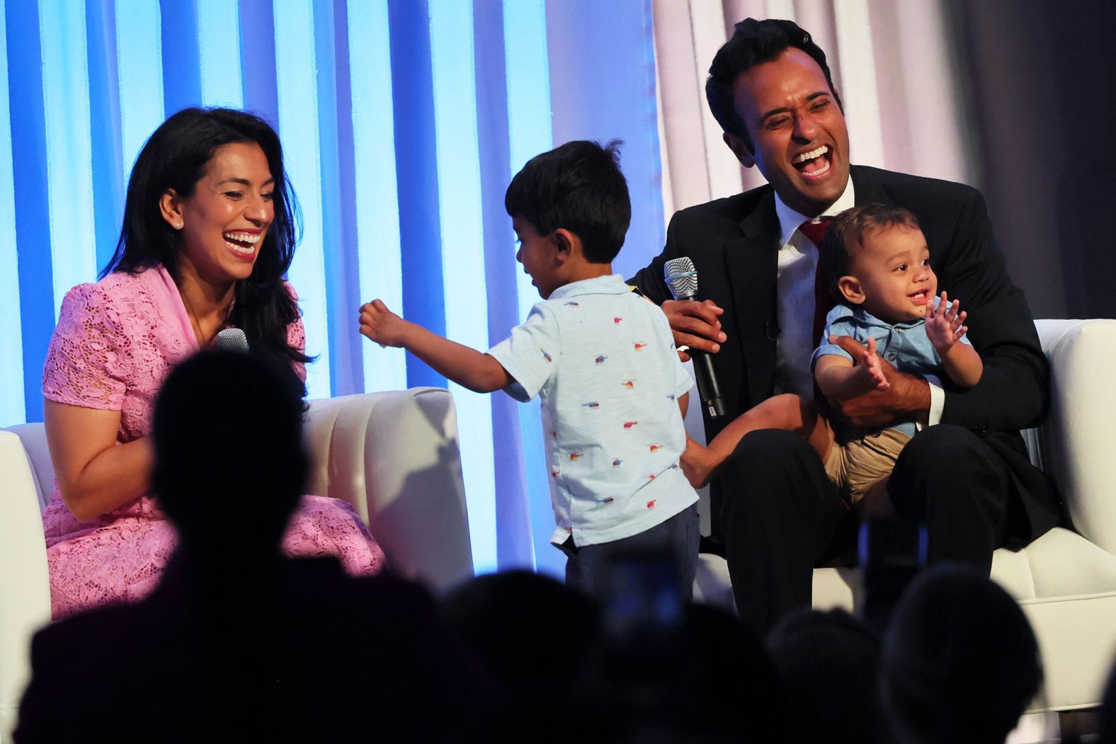 Ramaswamy is joined on stage by his wife, Apoorva, and their sons Karthik, left, and Arjun during the Moms for Liberty National Summit in Philadelphia in July 2023. Apoorva Ramaswamy is a throat cancer surgeon at Ohio State University.