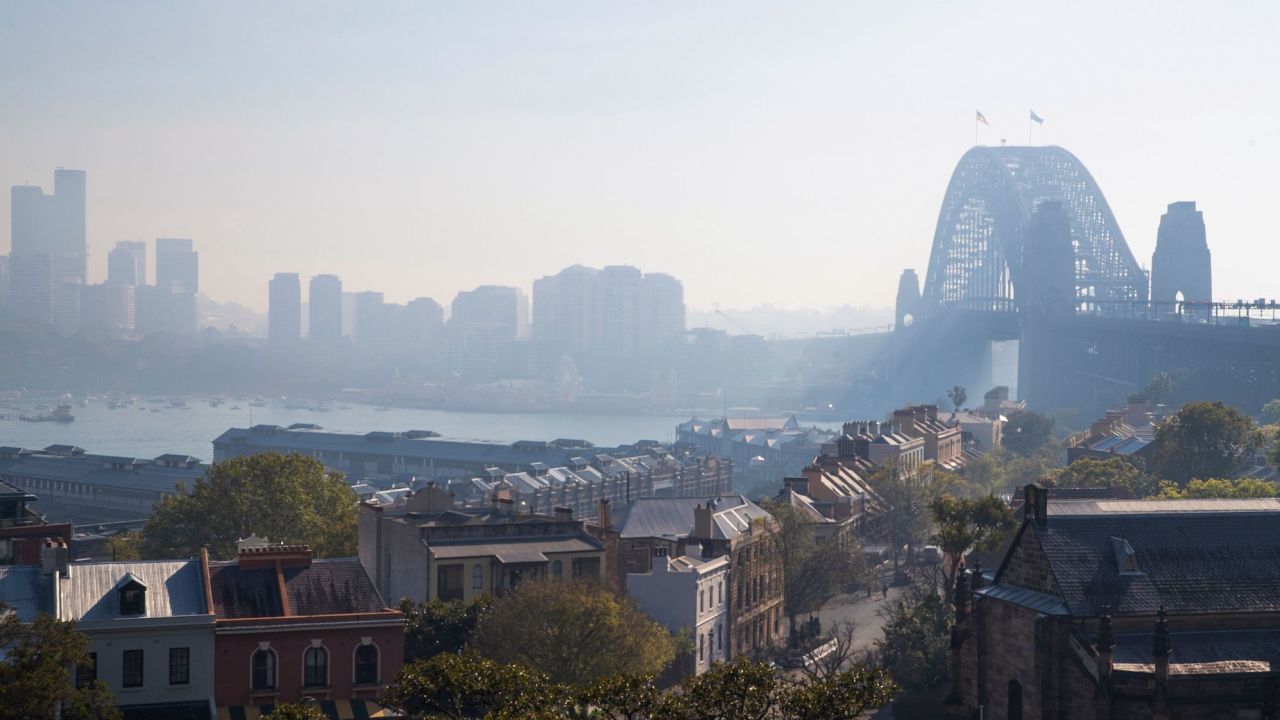 Sydney Harbour Bridge shrouded by smoke on September 13, 2023, after controlled blazes burned on the city's fringes in preparation for the looming bushfire season.