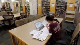 In this June 2019 photo, a student works in the library at Virginia Commonwealth University in Richmond, Virginia.