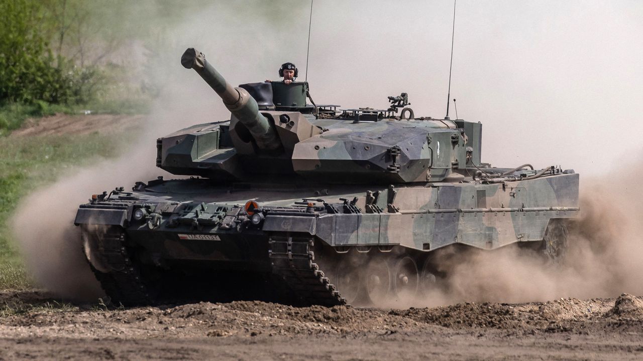 This picture taken on May 19, 2022 shows soldiers on a Polish Leopard tank as troops from Poland, USA, France and Sweden take part in the DEFENDER-Europe 22 military exercise, in Nowogard, Poland. - Poland's Defence Minister Mariusz Blaszczak on January 24, 2023 said Warsaw had asked Germany for permission to send its German-made Leopard tanks to Ukraine. - ALTERNATIVE CROP (Photo by Wojtek RADWANSKI / AFP) / ALTERNATIVE CROP (Photo by WOJTEK RADWANSKI/AFP via Getty Images)